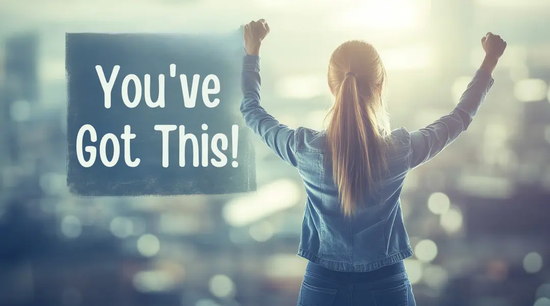 Back view of a woman raising her arms in triumph with the words 'You've Got This!' displayed, symbolizing confidence and motivation.